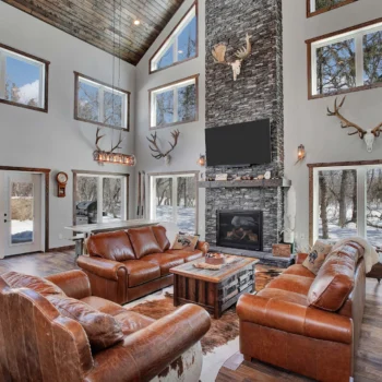 Drop-Tine Ranch living room with stone fireplace