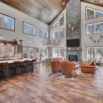 Drop-Tine Ranch main living area with stone fireplace