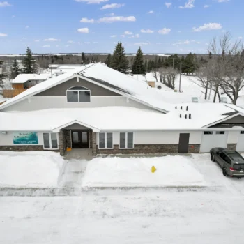 St. Brieux Manor front exterior with attached garage